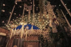 a large chandelier with christmas lights in a building at Casa Lolita Hotel-Boutique in Portoviejo