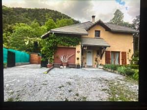 a house with a driveway in front of it at Chambre Boscodon in Savines +30 photos