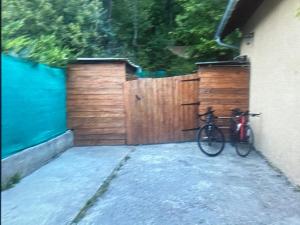 a bike parked next to a wooden fence at Chambre Boscodon in Savines