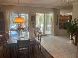 a dining room and living room with a table and chairs at Ferienhaus Marhardt in Oslip