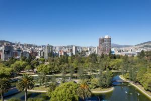 a view of a city with a river and trees at Top Rentals EpiQ in Quito