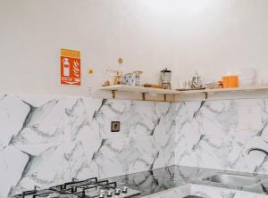 a kitchen with marble counter tops and a sink at Shaka Ashore Imsouane in Imsouane +64 photos