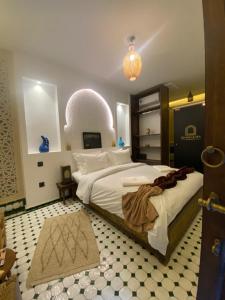 a bedroom with a large bed in a room at RIAD KS & SPA in Marrakesh +153 photos