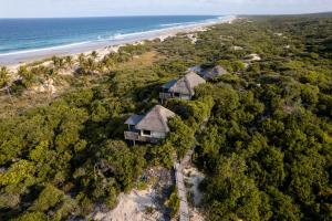 an aerial view of a resort on the beach at Travessia Beach Lodge in Inhambane +48 photos
