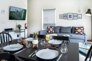 a living room with a table and a couch at The First Tracks Flat in Revelstoke