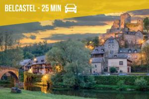 a poster of a town with a castle and a river at La Nef - Climatisation, Parking & Wifi à 150m de la Cathédrale in Rodez
