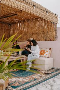a group of people sitting on a couch at Shaka Ashore Imsouane in Imsouane