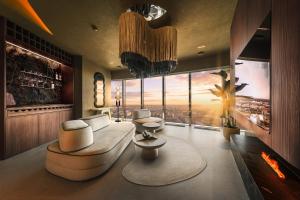 a living room with a view of a city at Sky Tower Apartamenty - In The Sky Apartments in Wrocław