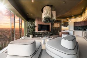 a luxury living room with a view of the city at Sky Tower Apartamenty - In The Sky Apartments in Wrocław