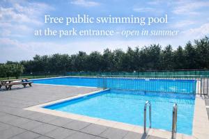a swimming pool at the park entrance open in summer at Comfort Villa for 8 People in Zeewolde