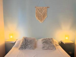 a bedroom with a bed with two lamps on it at Piccolo Rifugio by anbra Properties --- WITH PARKING AND FREE WIFI in Rapallo