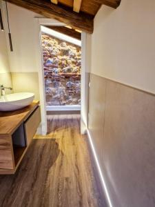 a bathroom with a sink and a window at Il Rivellino in Marostica +50 photos