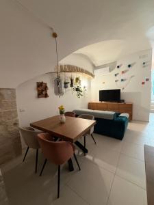 a living room with a table and a couch at Virgin Mare in Giovinazzo