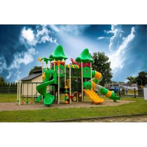a playground with a slide in a park at Noclegi Cristal in Malbork +24 photos