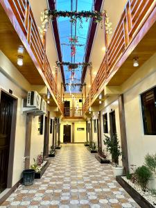 an empty hallway in a building with a ceiling at Arron Grand Inn in Zamboanga