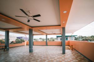 an empty room with a ceiling fan on a roof at Arron Grand Inn in Zamboanga +2 photos