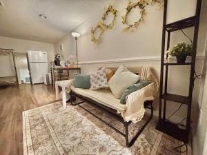 a living room with a couch with pillows on it at Comfy Private Basement- Scarborough in Toronto