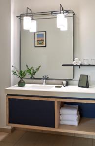 a bathroom with a sink and a mirror at Emery Hotel, Autograph Collection in Minneapolis