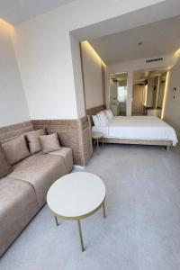 a living room with a couch and a bed at Belenus Thermalhotel in Zalakaros +93 photos