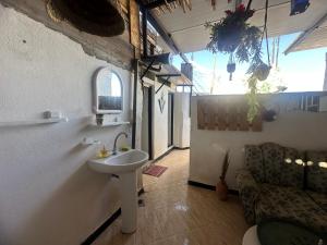 a bathroom with a sink in a room at The Trizit in Taghazout +67 photos