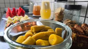 a bowl of food sitting on a table with food at Hotel Pousada Positiva in Itabuna +169 photos