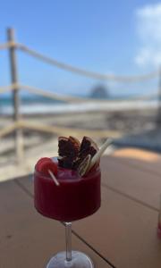 a dessert in a glass with a toothpick in it at STUDIO La Diamantinoise in Le Diamant