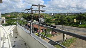 a balcony of a building with a view of a street at Hotel Pousada Positiva in Itabuna