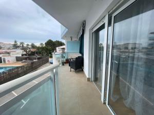 a balcony of a house with a large glass window at La Cenia in Denia