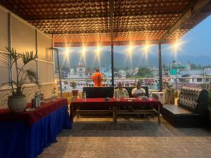a group of people sitting at a table in a restaurant at Hotel Atithi in Surkhet