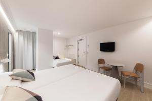 Posteľ alebo postele v izbe v ubytovaní Hotel Mar del Plata