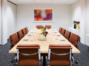 a large conference room with a long table and chairs at Art Series - The Watson in Adelaide +51 photos