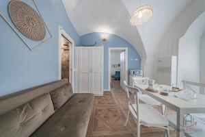 a dining room with a table and a white table and chairs at Borgo castello - trekking point - 8 min Sea - AC in Loano