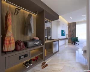 a hotel room with a bedroom and a room at Hotel Sanskar Elite By Keshav Global in Jaipur +38 photos