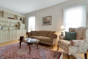 a living room with a couch and a chair and a table at The Nicholson Inn in Freeport