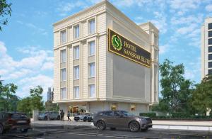 a building with a sign on the side of it at Hotel Sanskar Elite By Keshav Global in Jaipur