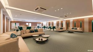 a large waiting room with couches and tables and chairs at Hotel Sanskar Elite By Keshav Global in Jaipur