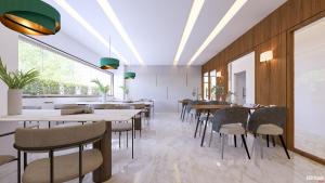 a dining room with tables and chairs at Hotel Sanskar Elite By Keshav Global in Jaipur