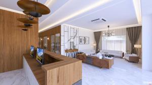 a living room with a couch and a tv in a room at Hotel Sanskar Elite By Keshav Global in Jaipur