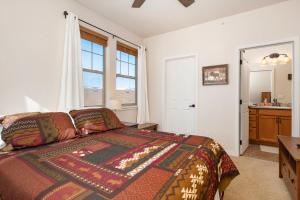 a bedroom with a bed and a window and a sink at Ten Mile G201 in Granby +12 photos