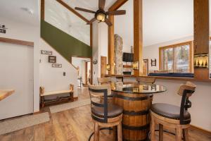 a tasting room with a bar with stools at Mountainside Unit B-20 in Granby