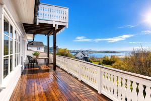 a balcony with a view of the water at Myranhuset - Amazing View in Moskenes