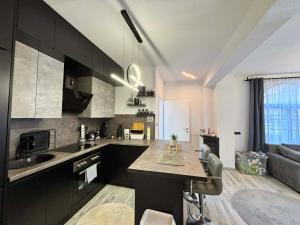 a kitchen with a sink and a counter in a room at Guest House Eden in Bihać