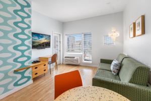 a living room with a couch and a table at The StarLux in Wildwood