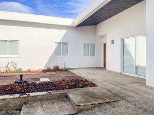 a white house with a driveway at Cozy & Calm Beach House in Ovar