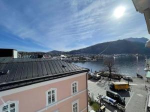 a view of a city and a body of water at SEEPERLE am See in Gmunden