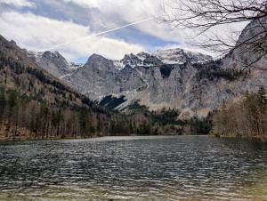 a lake in the middle of a mountain range at SEEPERLE am See in Gmunden +4 photos
