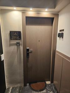 a door in a room with a sign on it at TRISAP Luxury Suites T Suite in Thessaloniki