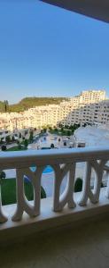a table on a balcony with a view of a beach at Apartament Silvi Super View in Varna City