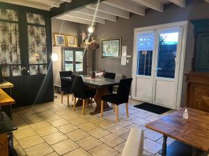 a dining room with a table and chairs at Chambres et Gîte Peyroutas "Amélie" à Vignonet St Emilion in Vignonet