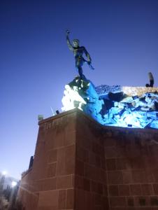 a statue of a man on top of a building at Casa Ayres de la Quebrada in Humahuaca